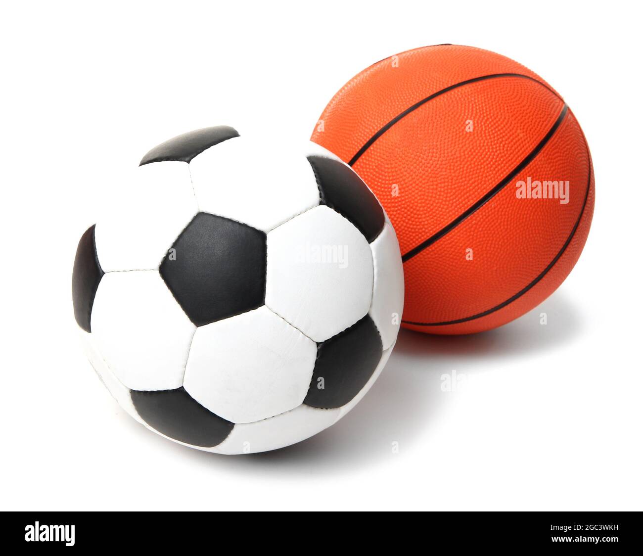 Basketball and football balls isolated on white Stock Photo Alamy