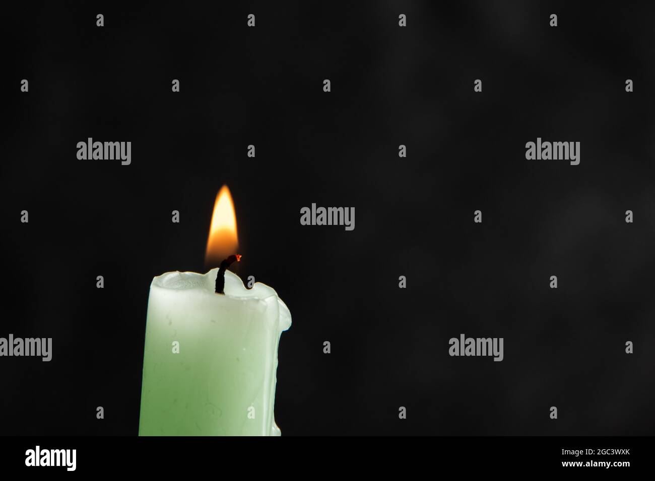 Candle on black background, Closeup of burning candle isolated on black ...