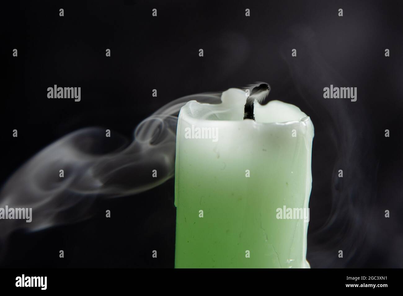 Smoke from a candle on a black isolated background. An interesting and