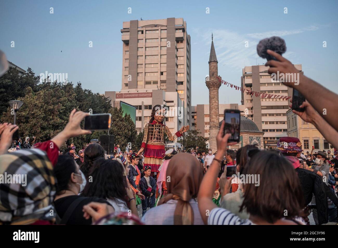 Izmir, Izmir, Turkey. 06th Aug, 2021. Izmir, . 6th Aug, 2021. The Walk Project. At the heart of The Walk is ''˜Little Amal', a 3.5 metre-tall puppet of a young refugee girl, created by the acclaimed Handspring Puppet Company. Representing all displaced children, many separated from their families, Little Amal will walk across Turkey, Greece, Italy, France, Switzerland, Germany, Belgium and the UK, with a finale event in Manchester, England in November 2021. She will travel a remarkable 8,000km in total, celebrating the power of art and shared humanity wherever she goes. (Credit Image: © Uygar  Stock Photo