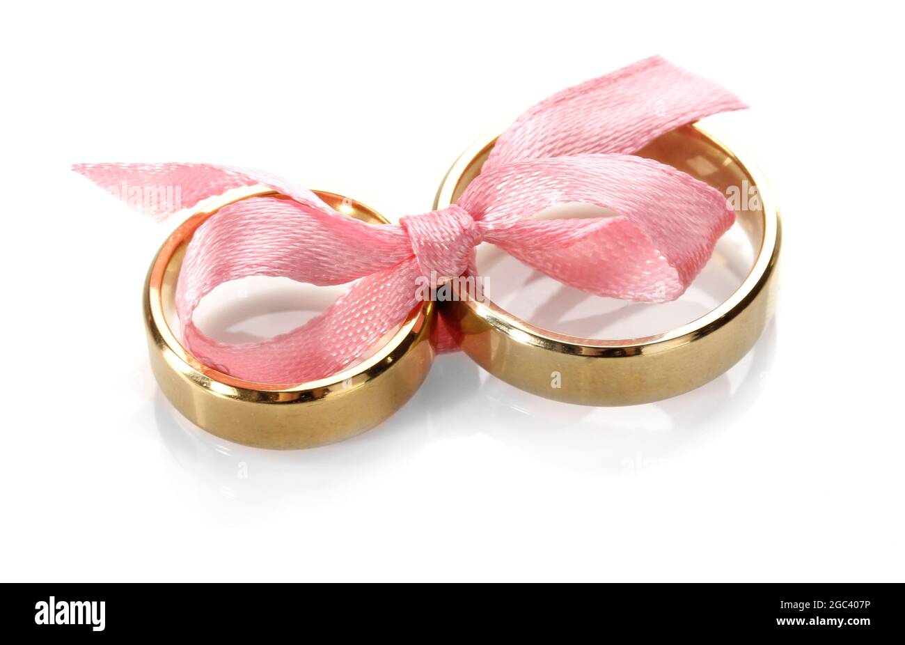 Wedding rings tied with ribbon isolated on white Stock Photo - Alamy
