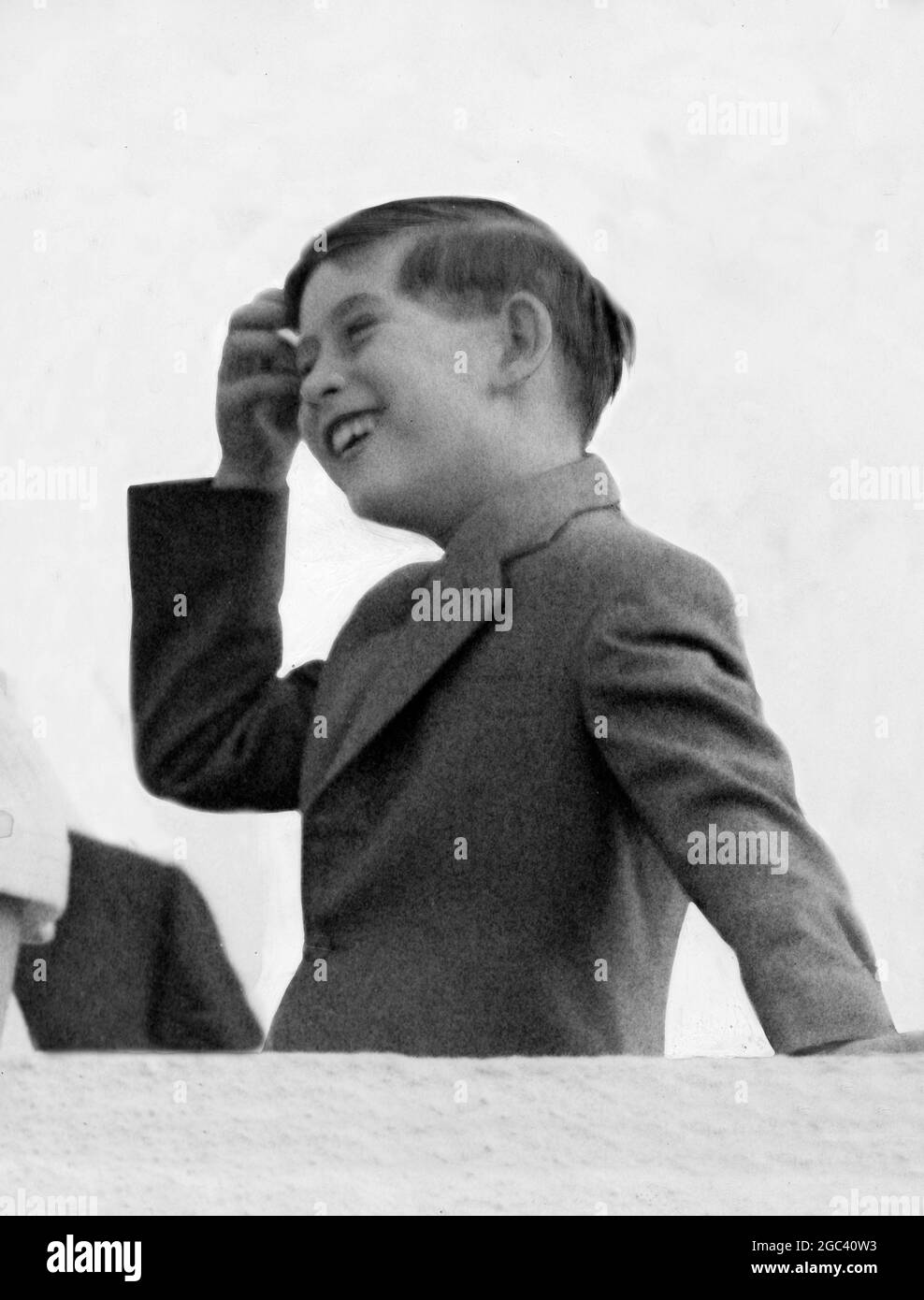 Prince Charles / Prince of Wales shows his delight on the roof of the VIP lounge at London airport today (Sunday) as he watches the arrival of the BOAC Comet jetliner bringing the Queen and the Duke of Edinburgh Prince Philip home from their 6 week Canadian tour. 2 August 1959 Stock Photo