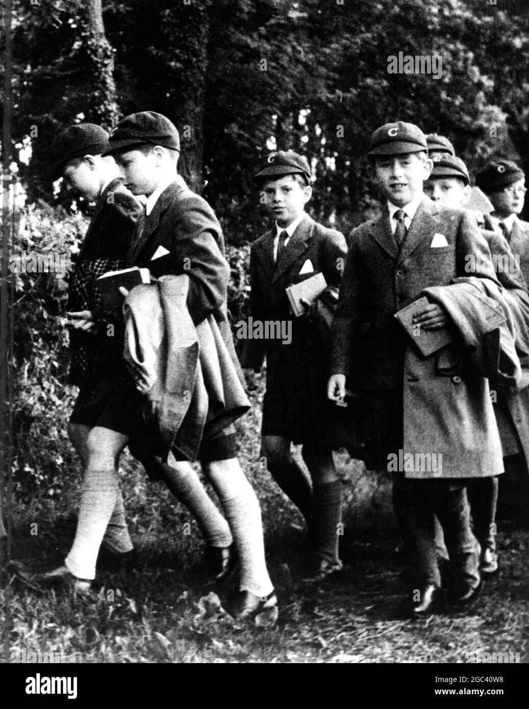 First Public Appearance as Prince of Wales. Prince Charles (right) walking back from St Peter's Church Headley on Sunday to Cheam School making his first appearance as The Prince of Wales, announced by the Queen in a recorded message at the end of the Empire Games at Cardiff. 28 July 1958 Stock Photo