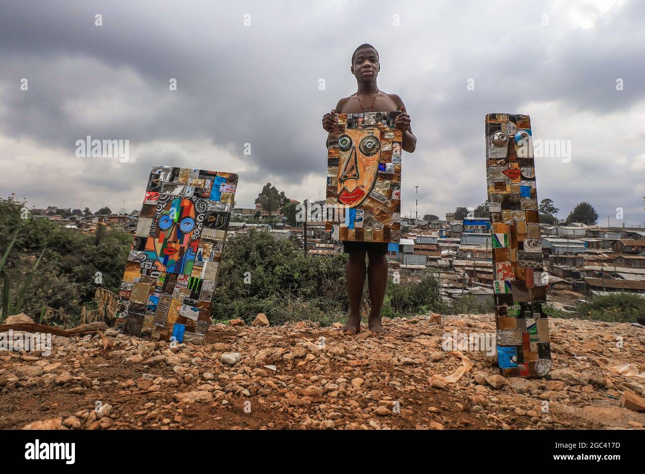 The 18 Year Old Saviour Omondi Performs His Solo Exhibition Of His Pieces Of Art That He Makes Using Recycled Cans And Pieces Of Old Iron Sheets In Kibera An 18 Year Old Artist Born And Raised