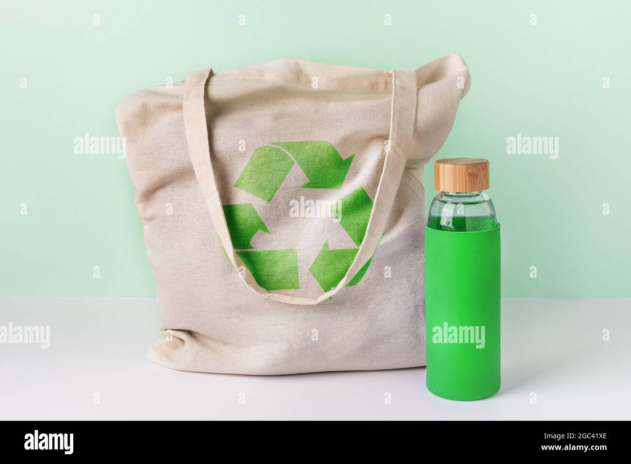 Natural cotton eco shopping bag and glass reusable water bottle. Zero waste concept Stock Photo Alamy