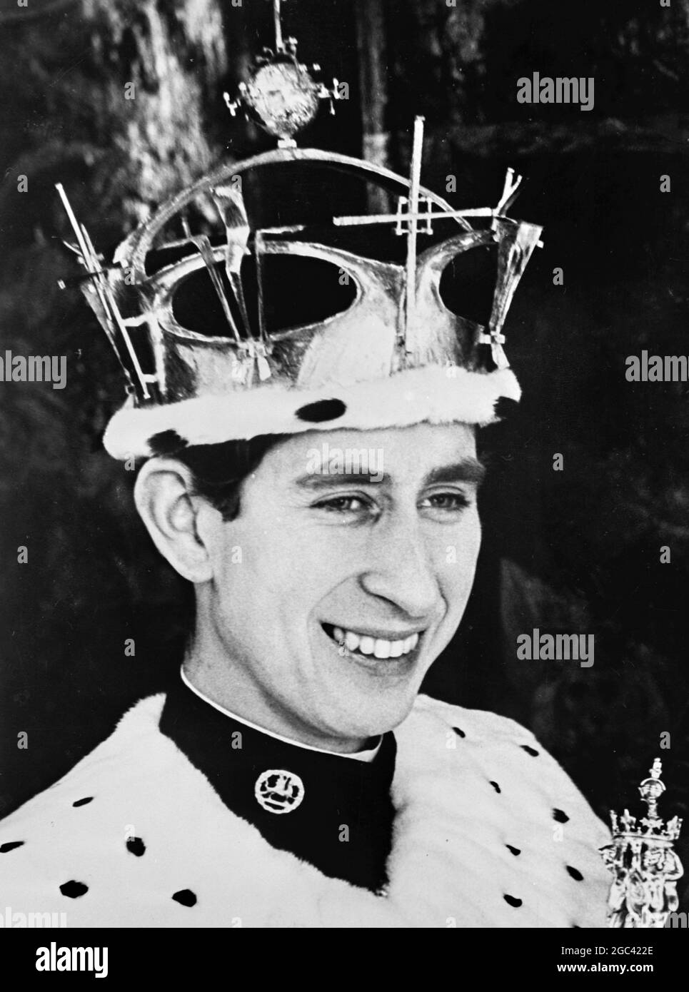 The official picture of Prince Charles, who will become the Prince of Wales, at a ceremony to be performed by Her Majesty Queen Elizabeth II at Caernarvon Castle, Wales on 1 July 1969. The Prince of Wales, pictured by Norman Parkinson at Windsor Castle, Berkshire is wearing his full regalia. Over a military uniform he wears an ermine robe. On his head is the Gold Coronet, weighing 3lbs and containing 75 diamonds and 12 emeralds. 25 June 1969 Stock Photo