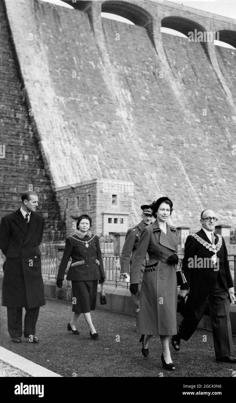 Elan Valley , Radnorshire: Queen Elizabeth II and Dke of Edinburgh officially opened the new reservoir of the Birmingham City Corporation on the River Claerwen , in the Elan Valley . Photo shows: Queen Elizabeth leaving the valve house after walking down inside the dam (in background) from the top . With her is the Lord Mayor of Birmingham , Alderman W T Bowen. The Duke of Edinburgh is accompanied by the Lady Mayoress and the Lord Lieutenant of Breconshire Major S T Raikes . 24 October 1952 Stock Photo