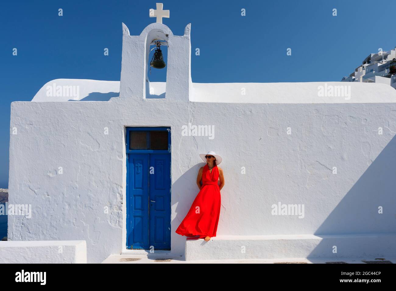 Woman in front of church in Santorini, Greece Stock Photo
