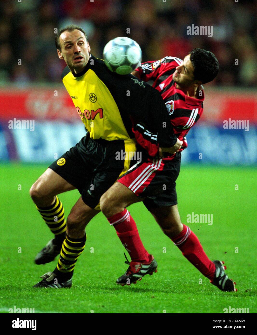 Leverkusen Germany 24.2.2002, Football: Bundesliga season 2001/02, Bayer 04  Leverkusen (B04, red) vs Borussia Dortmund (BVB, yellow) 4:0 -- Juergen  KOHLER (BVB), Yildirai BASTUERK (B04 Stock Photo - Alamy