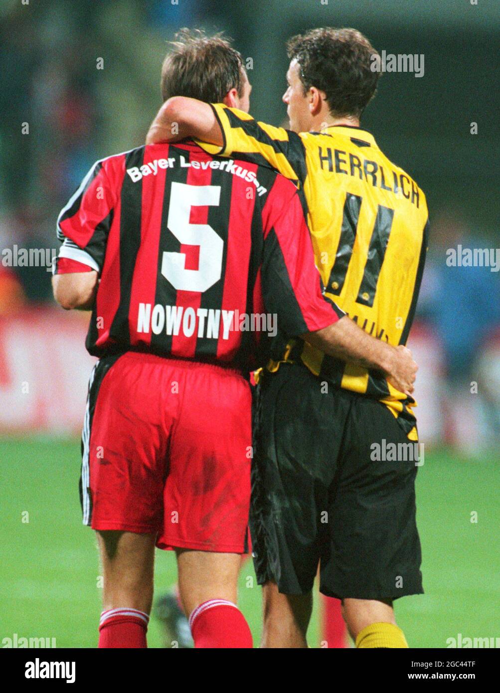 Leverkusen Germany 24.2.2002, Football: Bundesliga season 2001/02, Bayer 04 Leverkusen (B04, red) vs Borussia Dortmund (BVB, yellow) 4:0 -- Jens NOWOTNY (B04), Heiko HERRLICH (BVB) Stock Photo