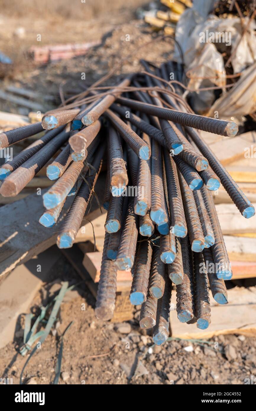 Reinforced steel bars on background of construction site with copy space. Metal base of reinforced concrete walls and buildings. Stock Photo