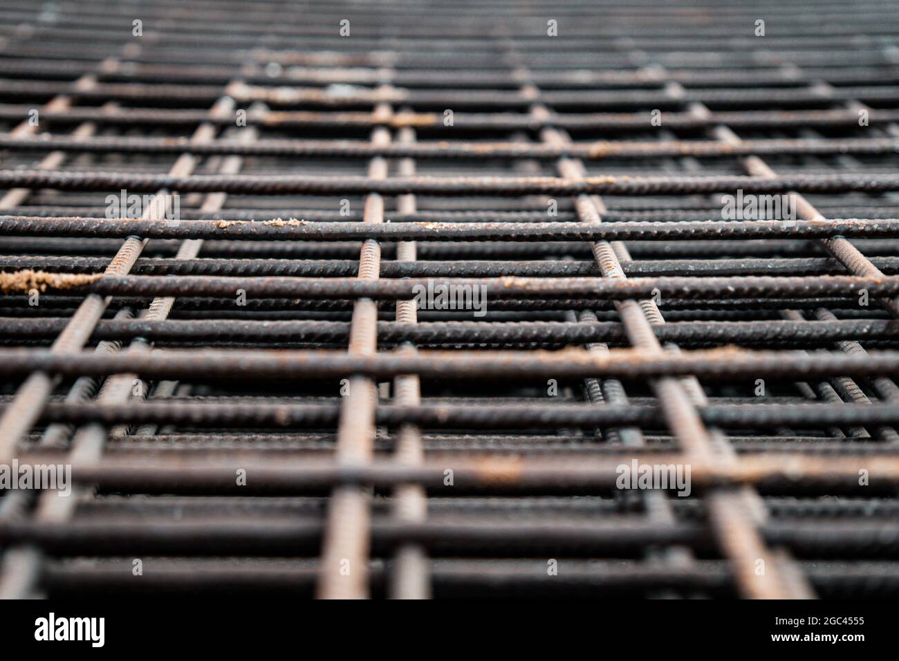 Reinforced steel bars on background of construction site with copy space. Metal base of reinforced concrete walls and buildings. Stock Photo