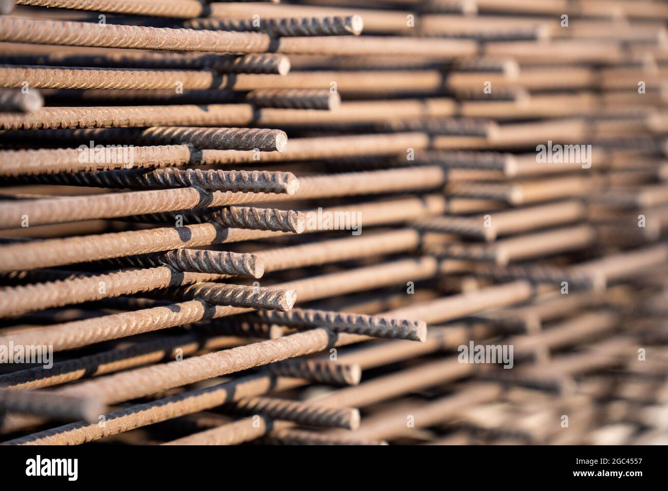 Reinforced steel bars on background of construction site with copy space. Metal base of reinforced concrete walls and buildings. Stock Photo