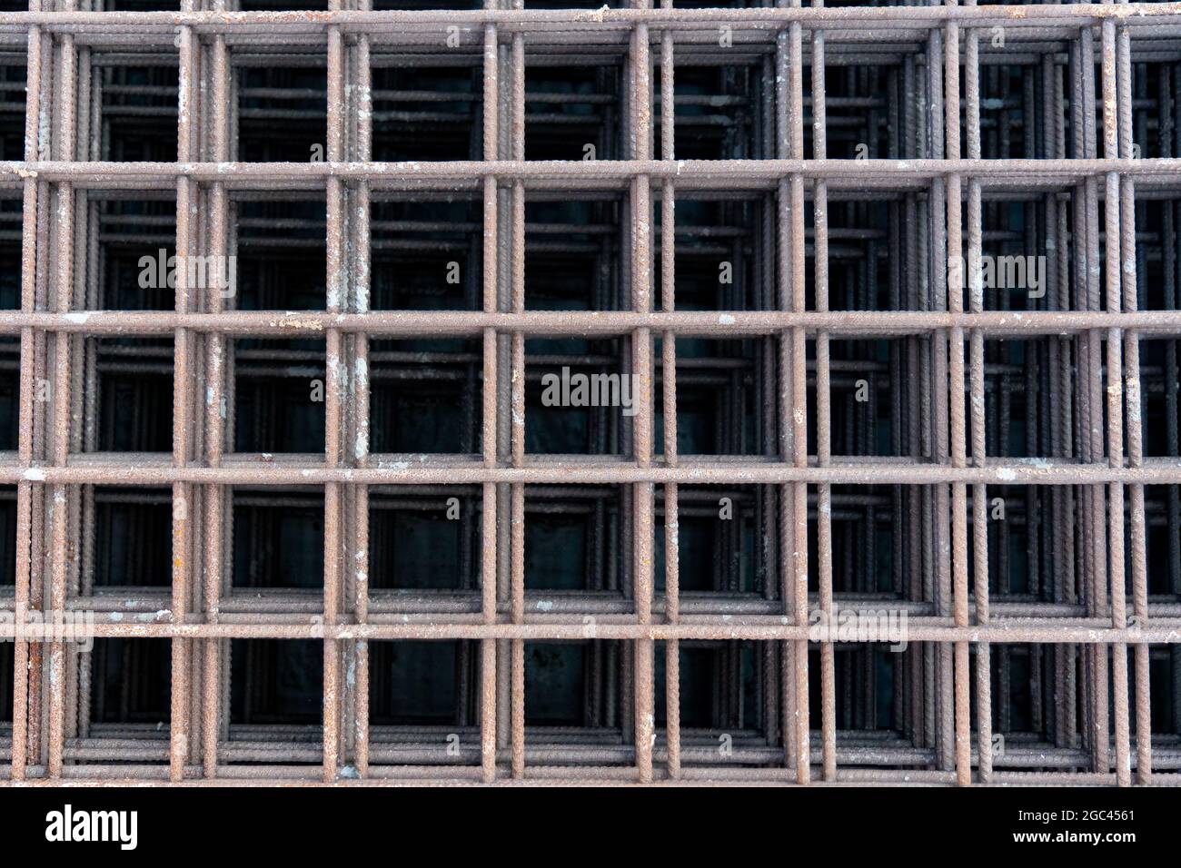 Reinforced steel bars on background of construction site with copy space. Metal base of reinforced concrete walls and buildings. Stock Photo