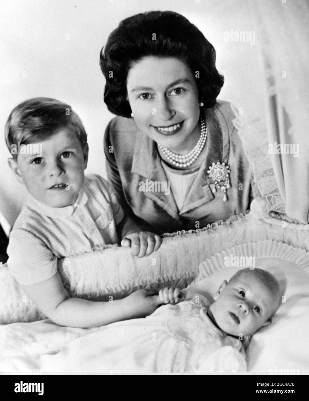 QUEEN ELIZABETH II WITH PRINCE ANDREW AND PRINCE EDWARD IN THE CRIB