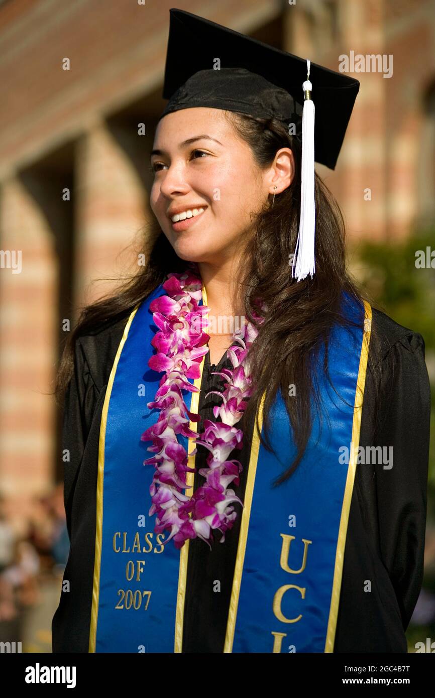 A young Hispanic woman graduates MR V Stock Photo
