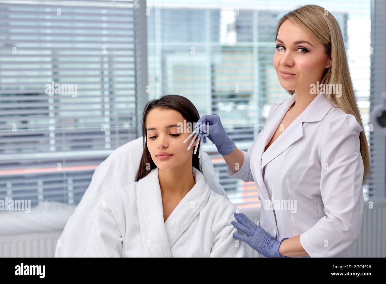 healthcare, medical and surgery concept. beautician or doctor with patient, preparing to do injection, Thread Lifting, PDO thread. Aesthetic beauty an Stock Photo