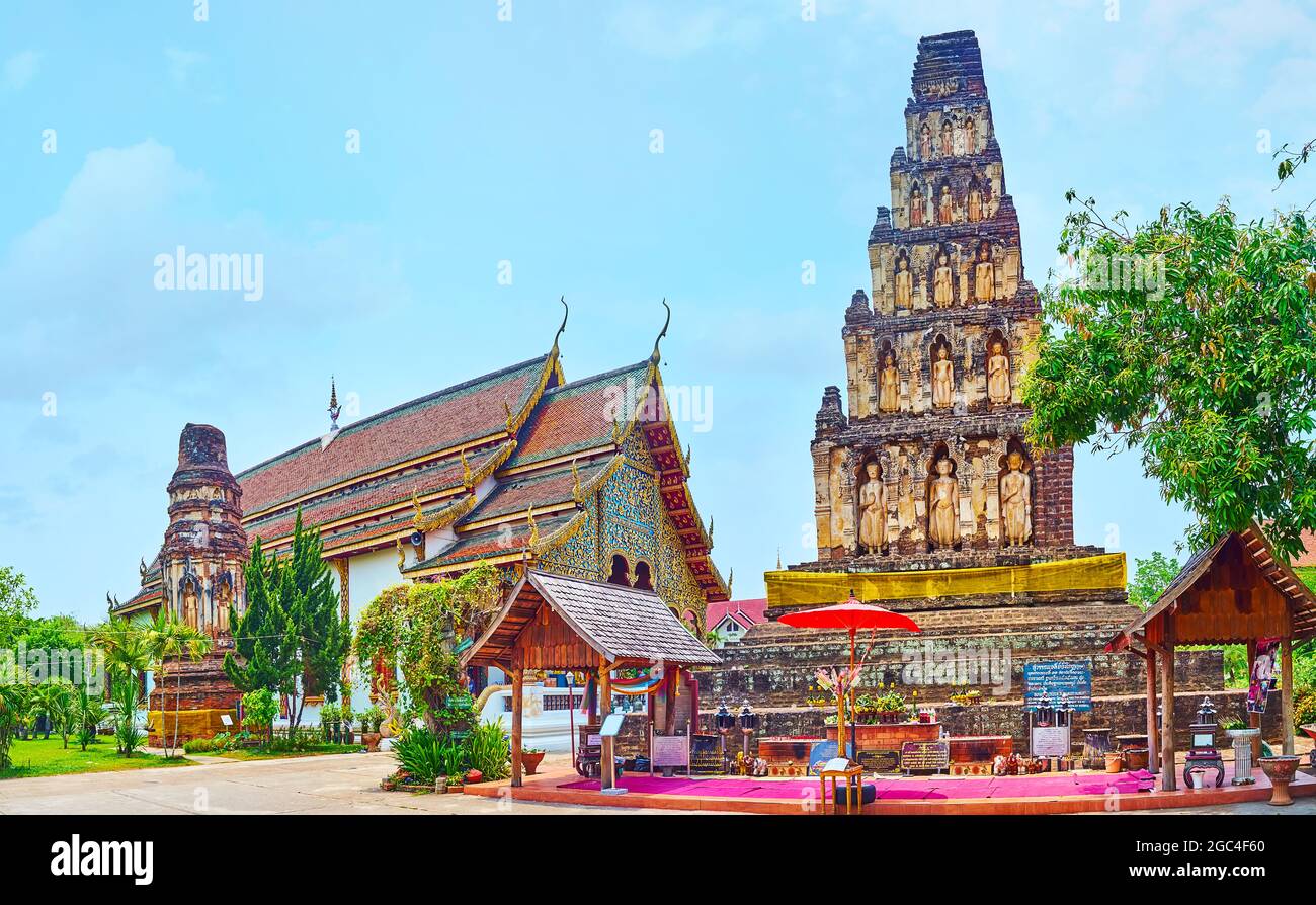 Panorama of historic  Wat Chammathewi (Wat Chamthewi, Wat Kukut) Temple with ruins of Ratana Chedi and tall Suwan Chedi Jungkote, Lamphun, Thailand Stock Photo