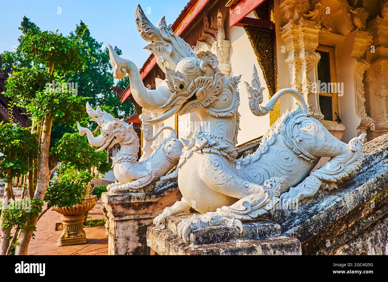The sculptures of Kochasri mythical creatures with body of lion and head of the elephant at the Viharn of Wat Pratu Pong, Lampang, Thailand Stock Photo