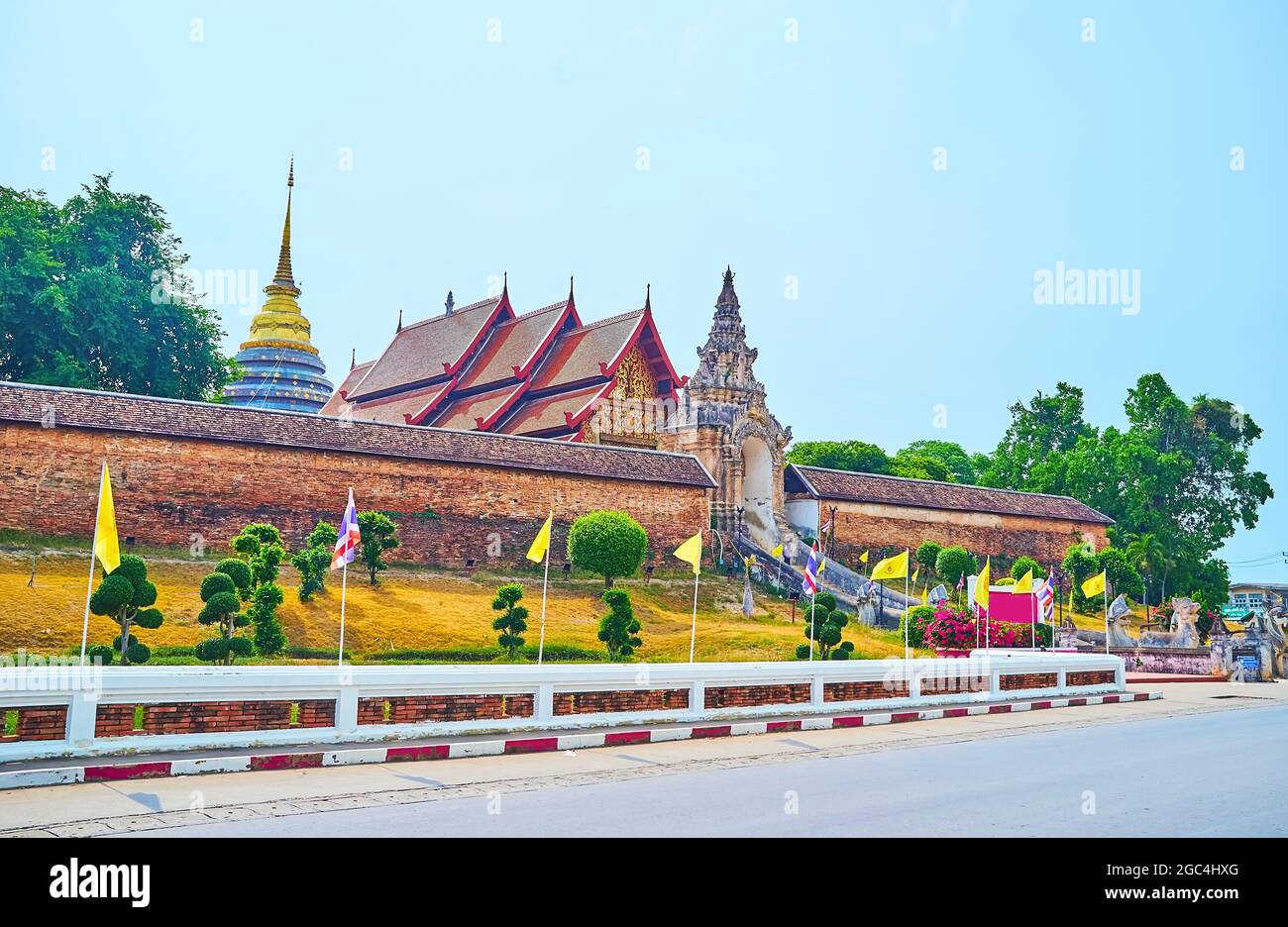 The rampart, pyathat roof and Chedi's spire of Wat Phra That Lampang Luang Temple, Lampang, Thailand Stock Photo