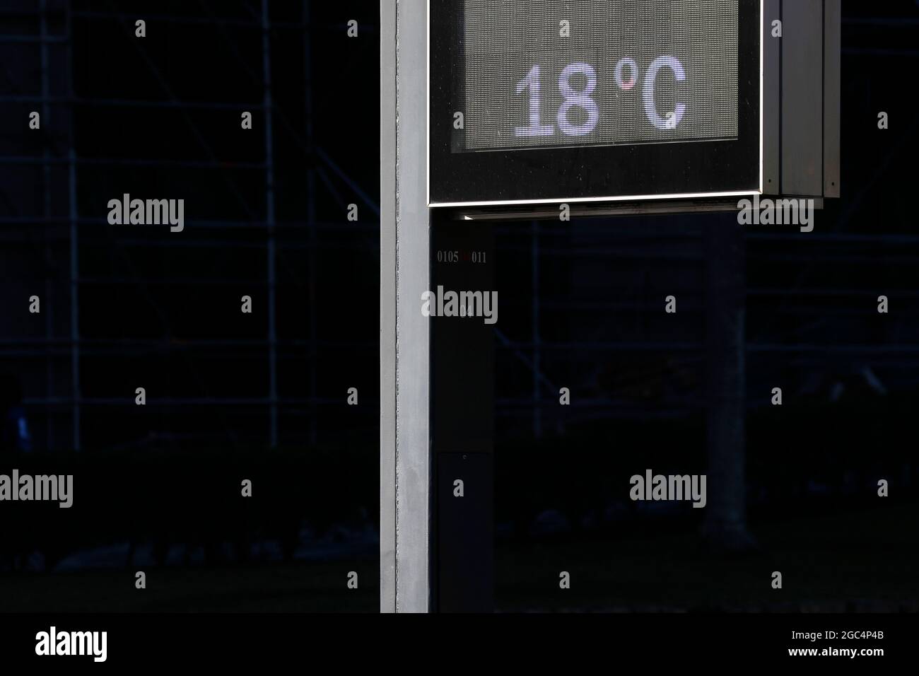 Temperature thermometer on street displays digital celsius degrees. Meteorology and weather device, climate change, global warming indicator. Stock Photo