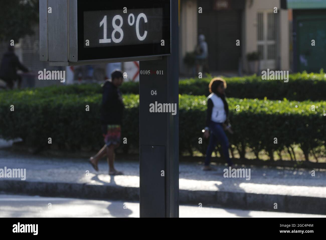 Temperature thermometer on street displays digital celsius degrees. Meteorology and weather device, climate change, global warming indicator. Stock Photo