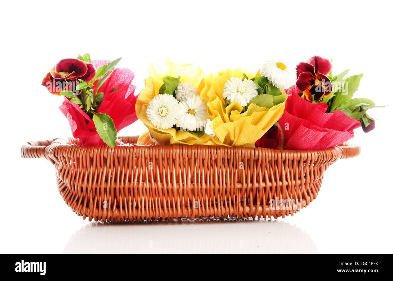 Beautiful spring flowers in basket isolated on white Stock Photo Alamy