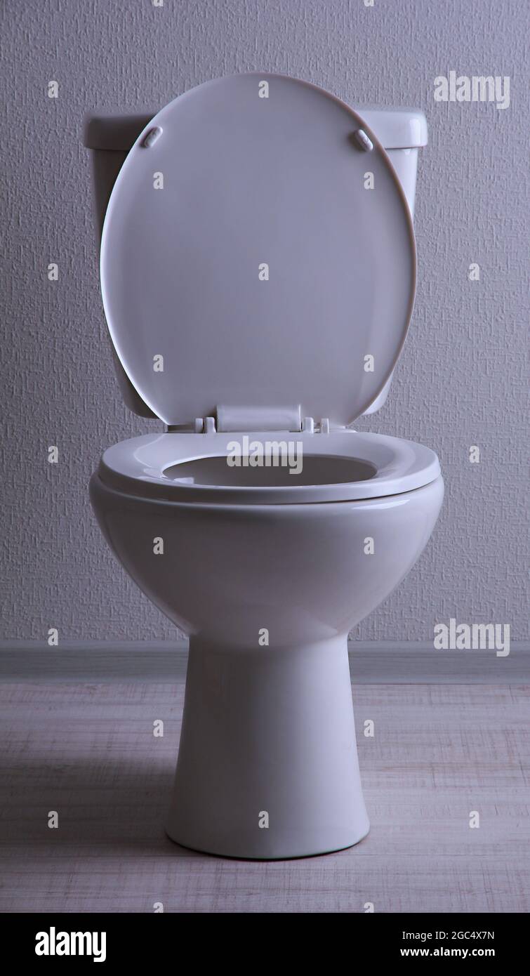 White toilet bowl in a bathroom Stock Photo - Alamy