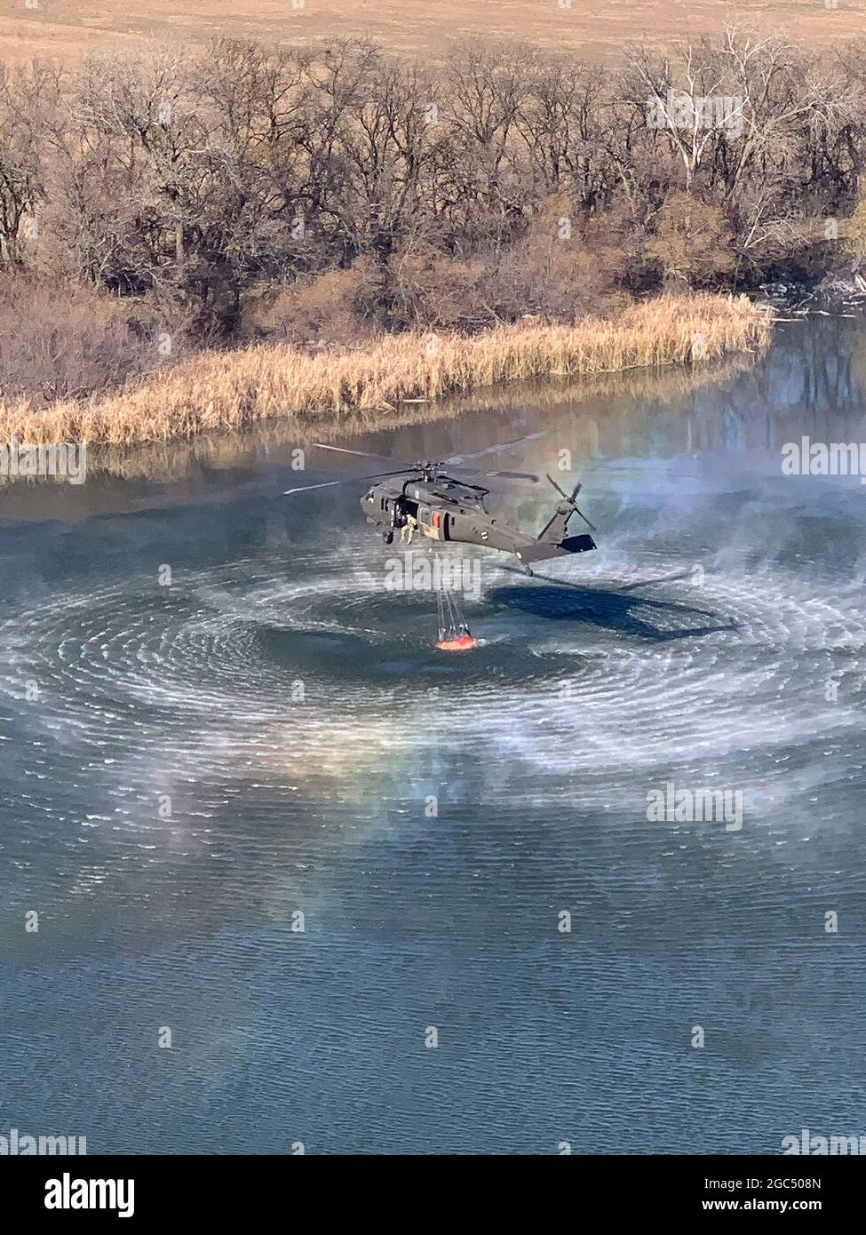 Military helicopter water pickup Stock Photo Alamy