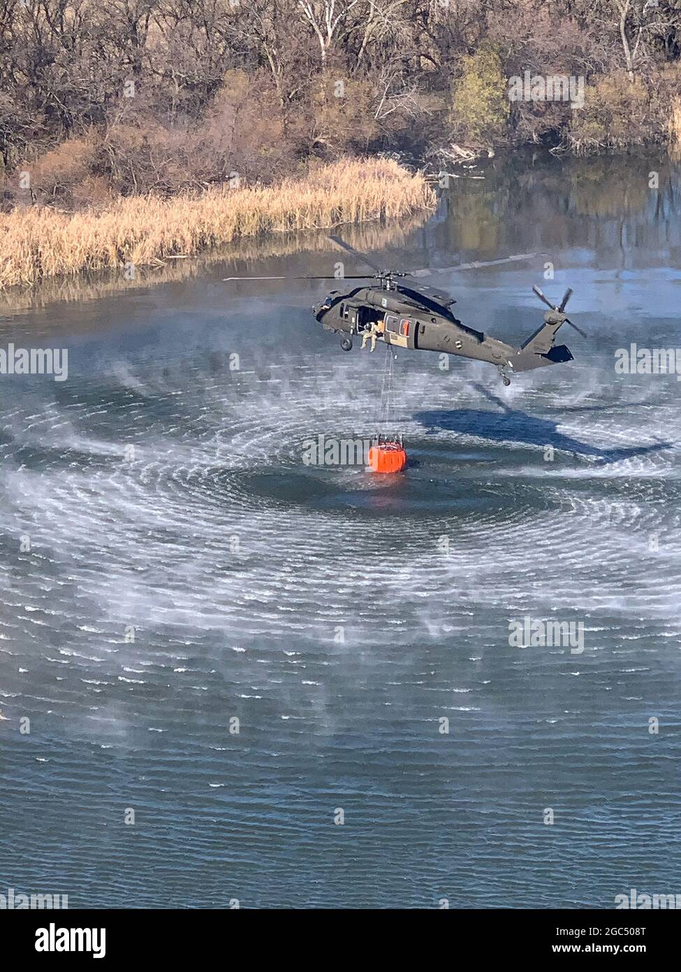 Military helicopter water pickup. Stock Photo