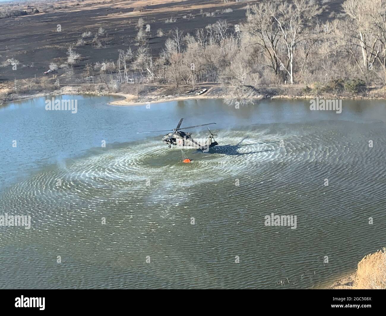 Military helicopter water pickup. Stock Photo