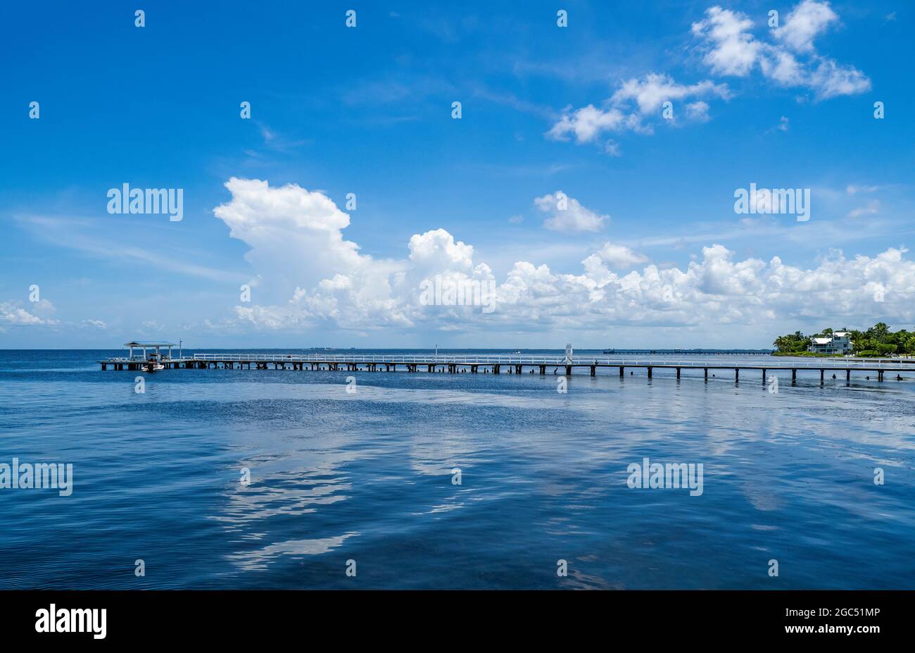 Pier on Gulf of Mexico in Bokeelia on Pine Island Florida USA on a summer day with smooth flot water Stock Photo