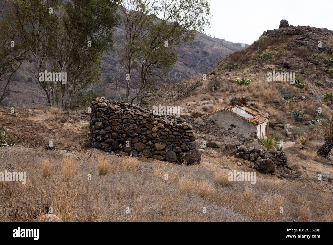 Small villages like Benchijigua at  La Gomera in the Canary Island have lots of ruins of Canarian Island houses built from lava rock. Stock Photo