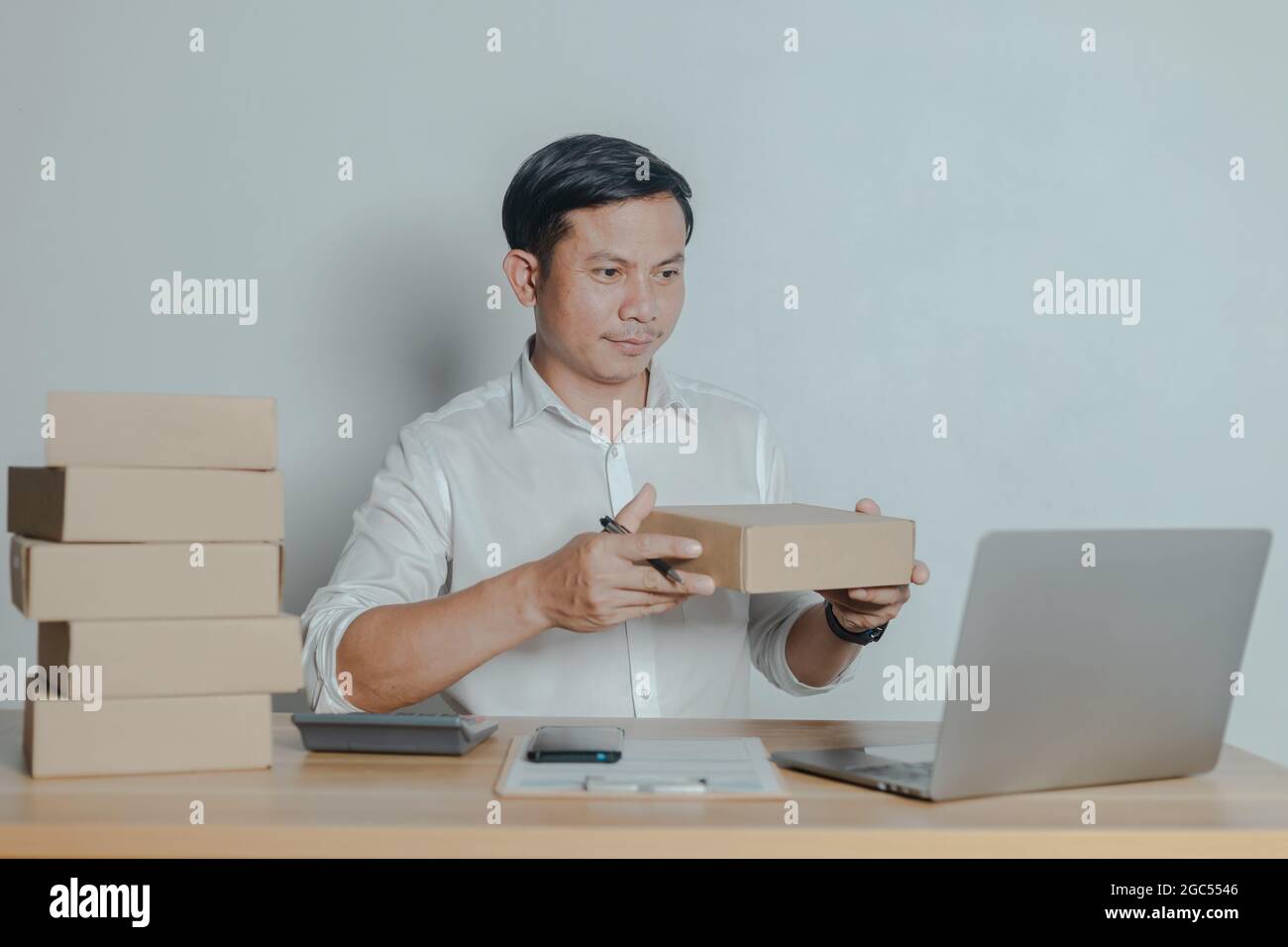 Man selling online at home small business ideas Stock Photo