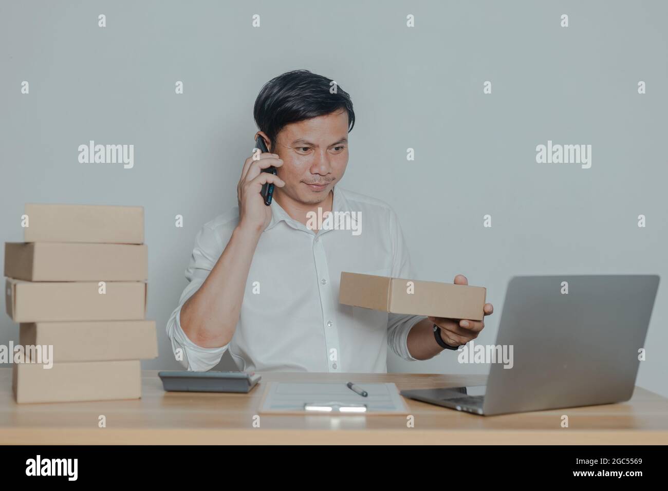 Man selling online at home small business ideas Stock Photo