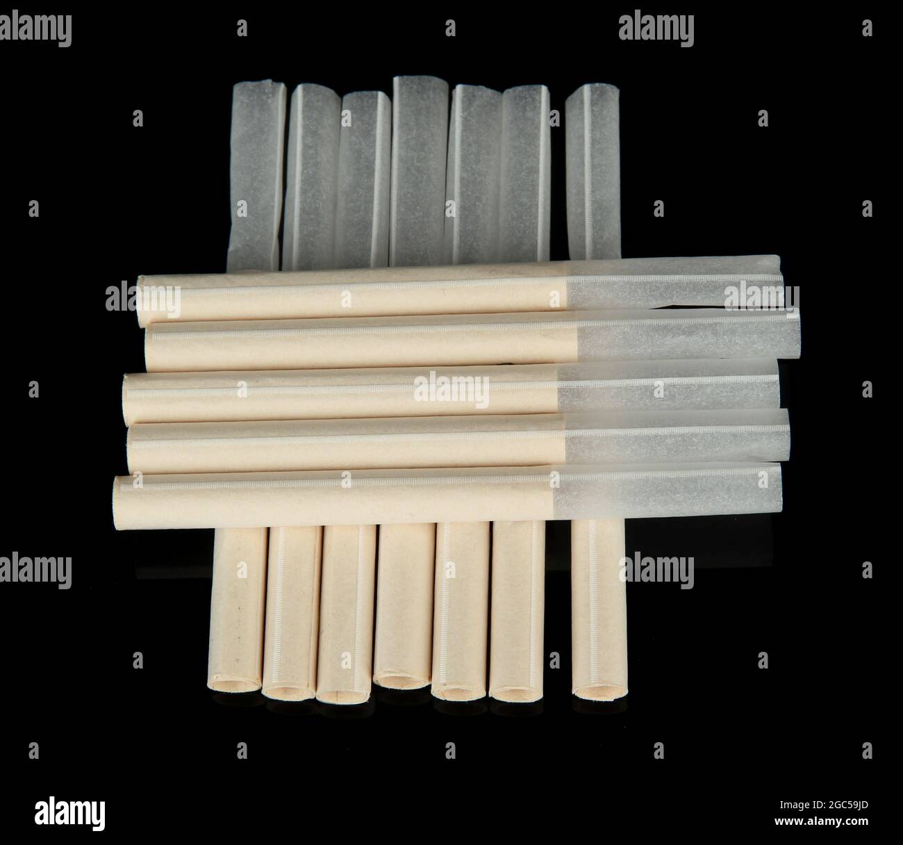 Empty cigarette tubes, isolated on black Stock Photo Alamy