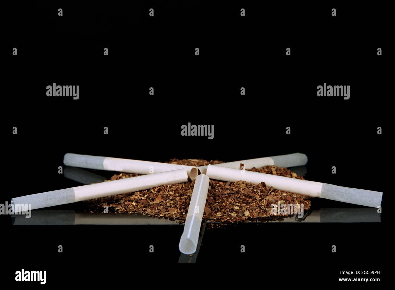 Tobacco and cigarette tubes, isolated on black Stock Photo Alamy