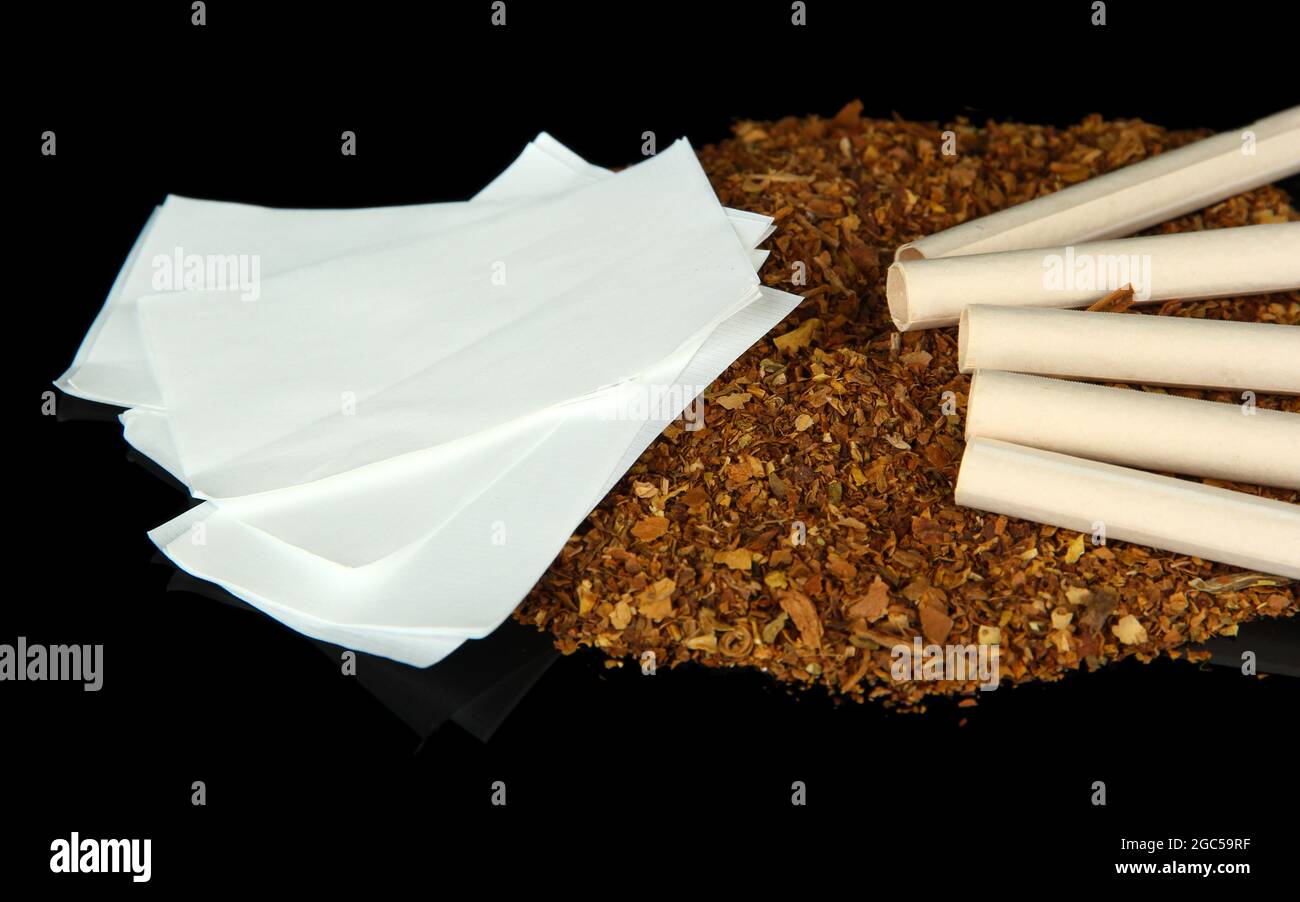 Tobacco and cigarette tubes, isolated on black Stock Photo Alamy