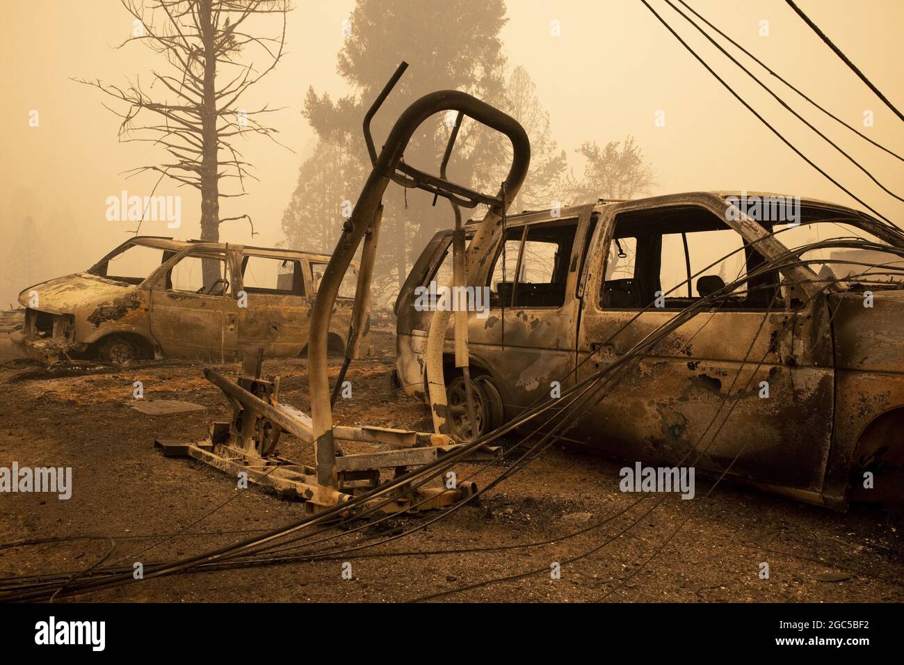 Greenville, USA. 06th Aug, 2021. The burned out remains of two cars and piece of exercise