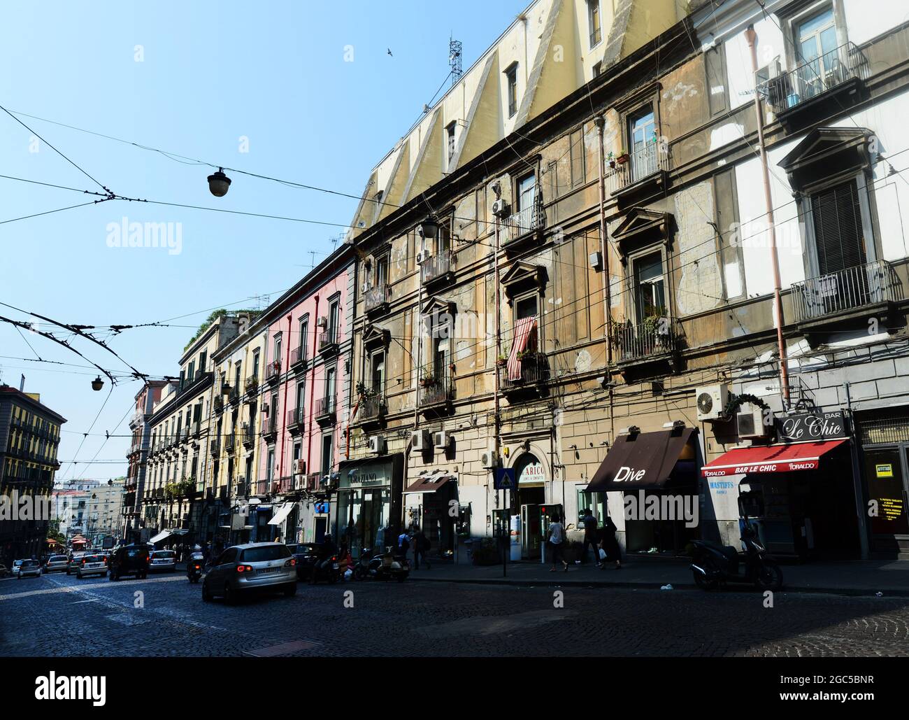 Shops and cafes on Via Enrico Pessina in Naples, Italy. Stock Photo