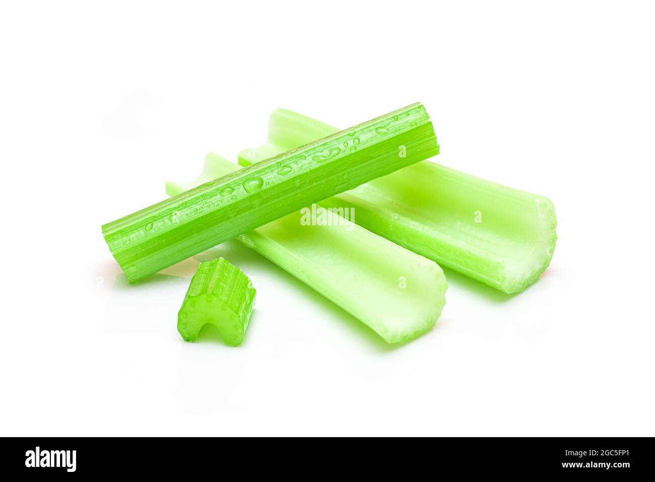 Fresh Chopped Celery Sticks with Water Drops Isolated on White