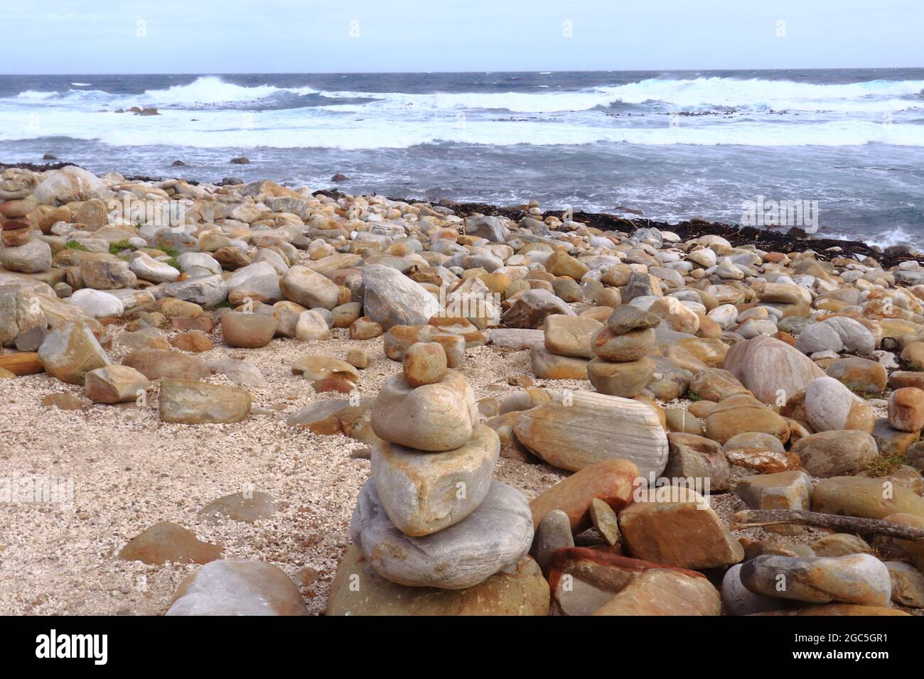 Rocks scattered at Maclear Beach at Cape of Good Hope in Cape Point National Park of Cape Peninsula, South Africa. Stock Photo