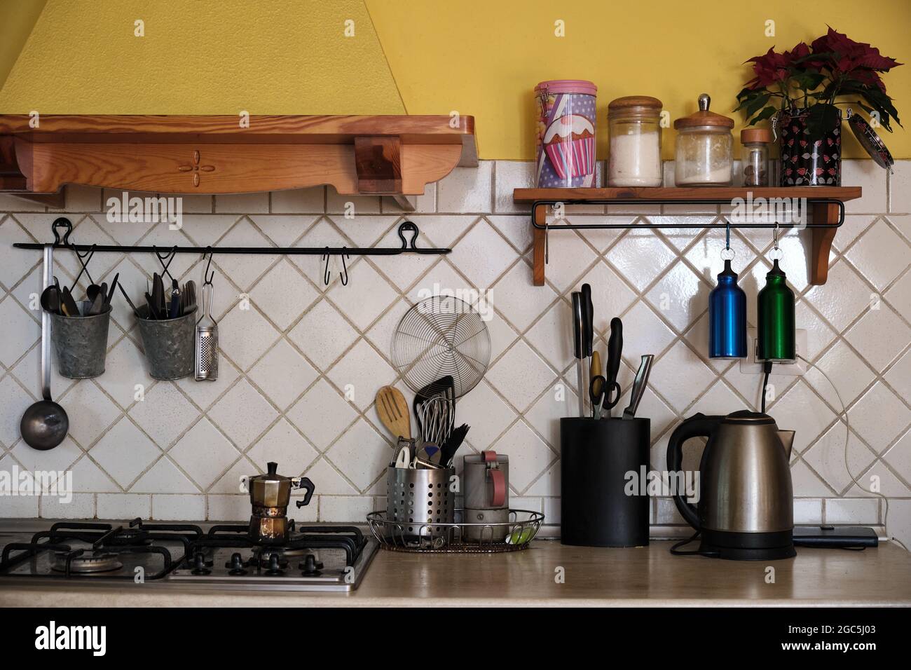 Closeup of kitchen counter full of utensils and kitchen equipment Stock Photo