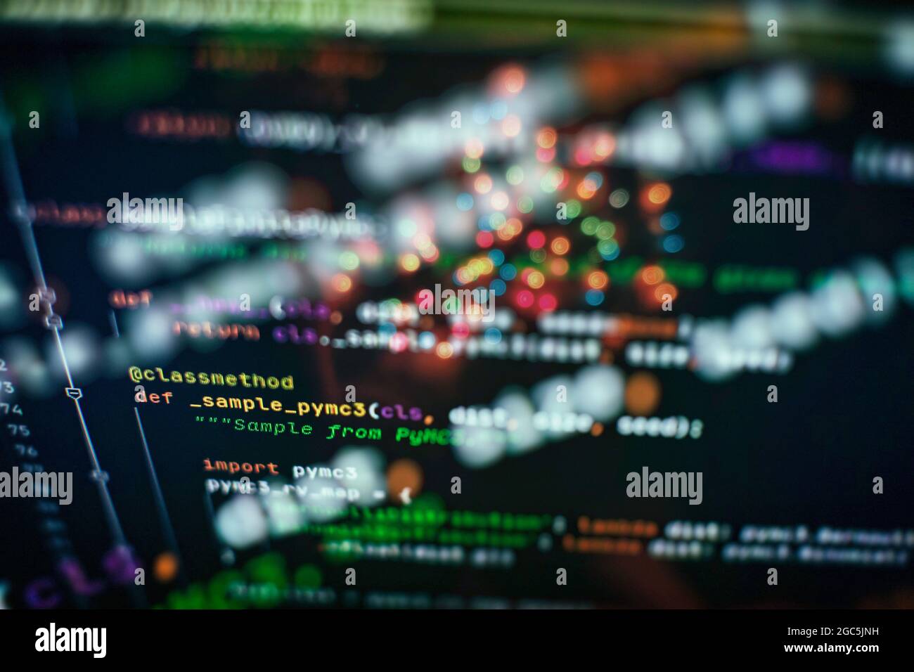 Hacker background, Programmer working in desktop laptop, Blurred screen with selective focus, JS, Closeup cooperating in web specialist apps, Tech sou Stock Photo
