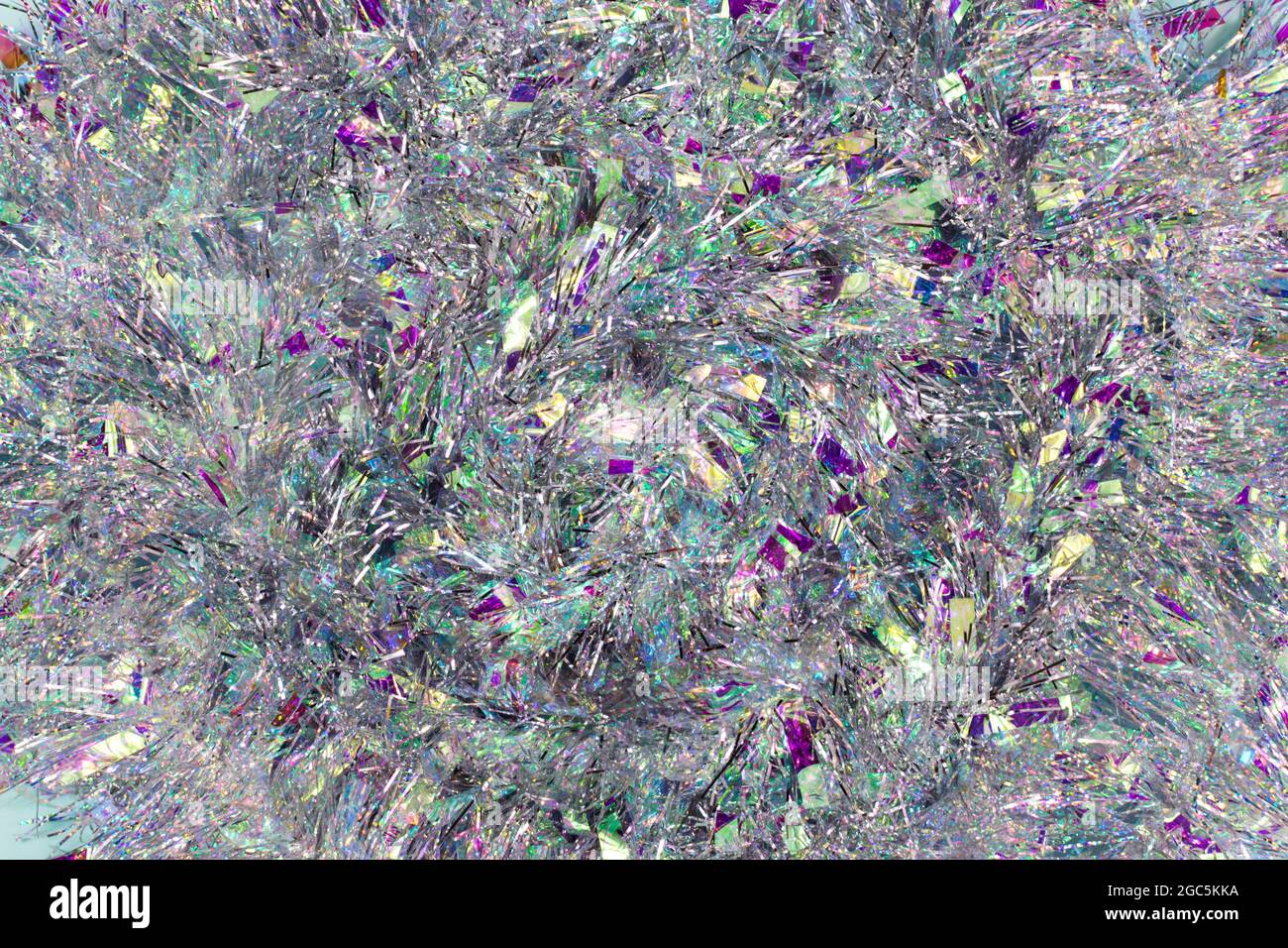 Christmas background with tinsel. Silvery background and beautiful bokeh. Stock Photo