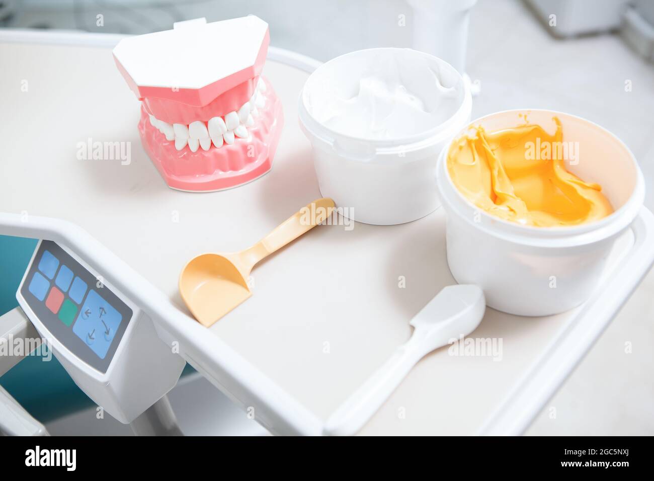 Dental putty and human jaw model on the table at dental clinic Stock