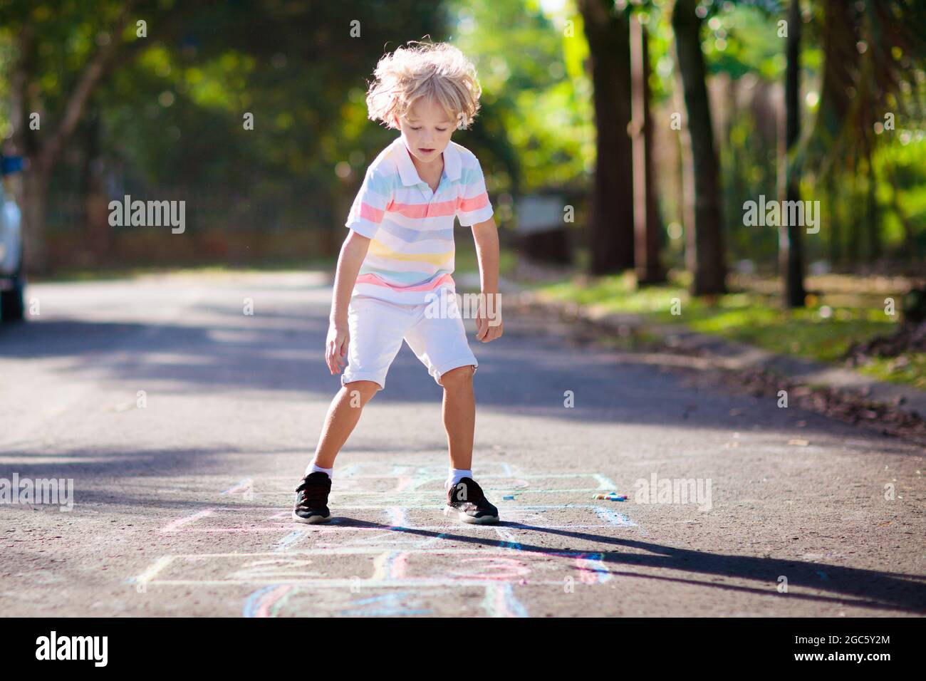 Kids play hopscotch in summer park. Healthy active outdoor game ...