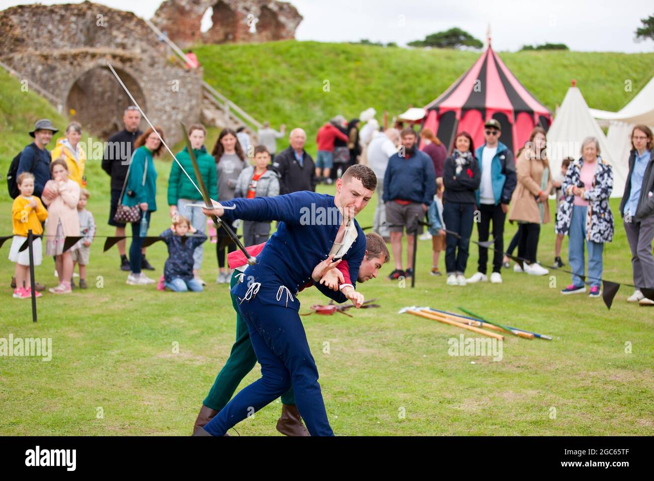 1st August 2021. Norfolk, England. Soldiers Through the Ages event at Castle Rising, the first public event at the 12th Century castle since before the Covid pandemic outbreak. Members of The Exiles medieval martial arts group demonstrating their sword skills and broad knowledge of armed and unarmed self-defence to visitors. Stock Photo
