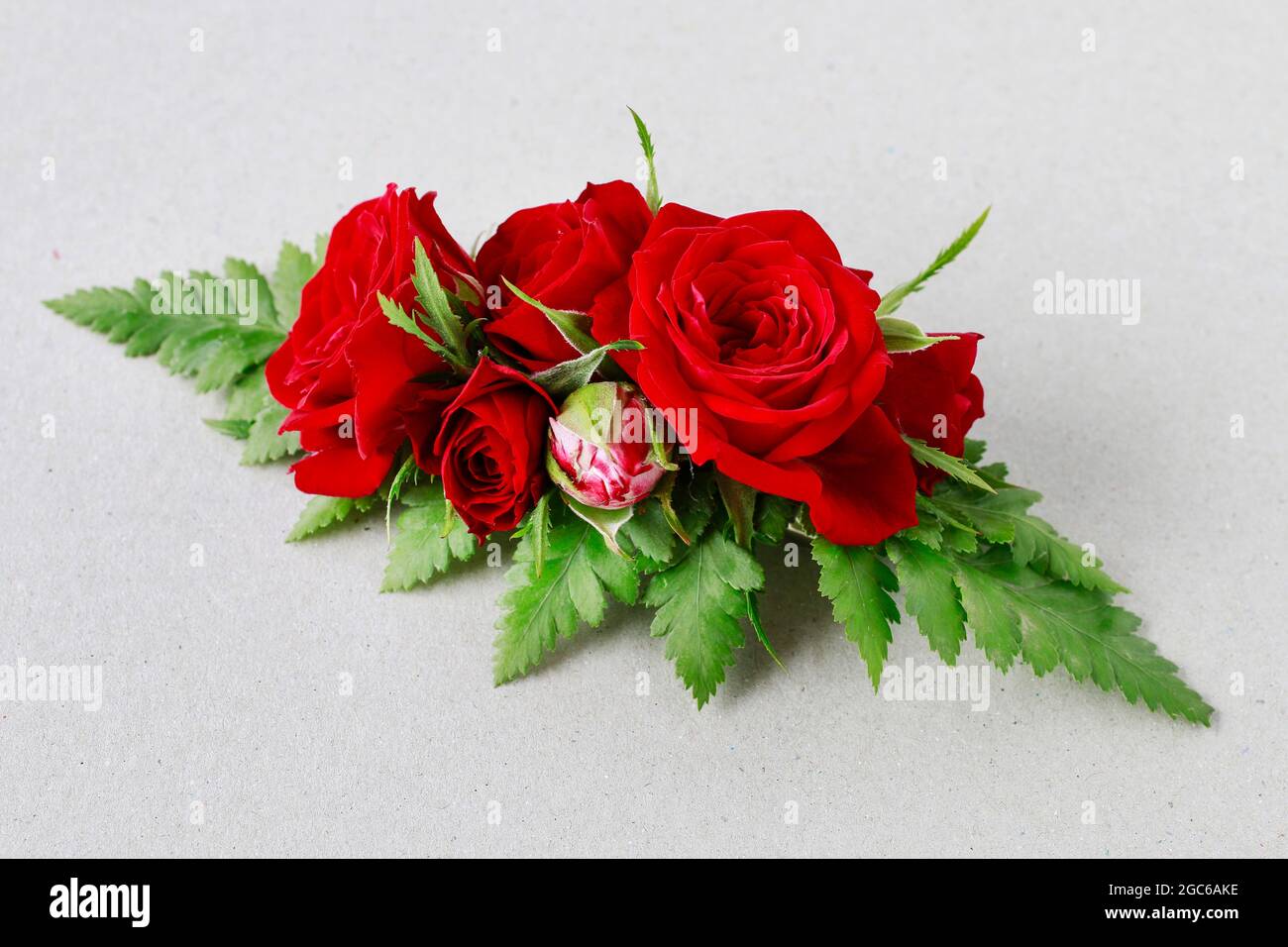 Florist at work: How to make a hair clip with fresh flowers and fern. Step  by step, tutorial Stock Photo - Alamy