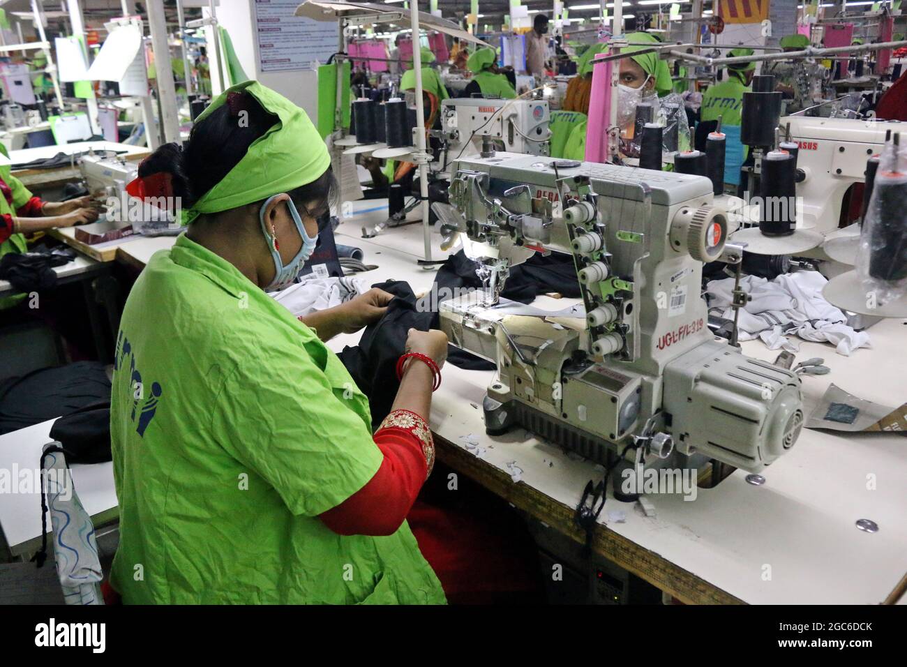 August 05,2021,Dhaka,Bangladesh Garment workers work at a factory after garment factories